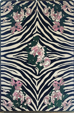 Hand-tufted rug with a black and white zebra pattern and pink floral design, accented with green leaves. Made from 100% New Zealand wool and fine viscose. Measures 6' x 9'.