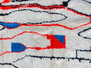 Moroccan Artistry | Handwoven Azilal Rug with Expressive Figures in Red, Blue, and Black