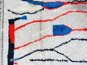 Moroccan Artistry | Handwoven Azilal Rug with Expressive Figures in Red, Blue, and Black