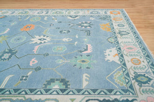 Frost & Flame | Hand-Knotted Turkish Rug in Blue & Ivory with Orange Accents