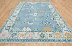 Frost & Flame | Hand-Knotted Turkish Rug in Blue & Ivory with Orange Accents