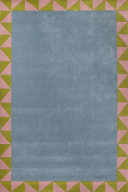 Hand-tufted rug with a rectangular shape, featuring a geometric design with a blue center and a pink and green border. Made from 100% New Zealand wool.