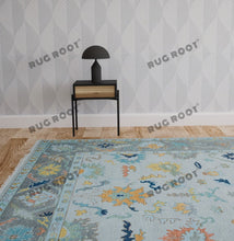 Load image into Gallery viewer, City Skyline Silhouette | Handwoven Oushak Rug | Light Blue with Pops of Color
