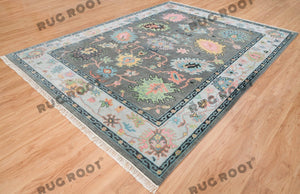 Midnight Garden | Handwoven Dark Grey & Blue Oushak Rug with Pink & Green Accents | Wool, Bedroom