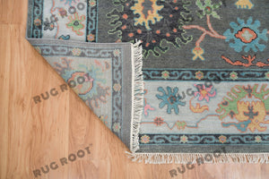 Midnight Garden | Handwoven Dark Grey & Blue Oushak Rug with Pink & Green Accents | Wool, Bedroom